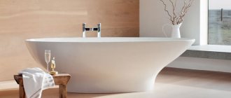 freestanding bathtub in the center of the room