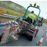 Laying optical cables in the road surface